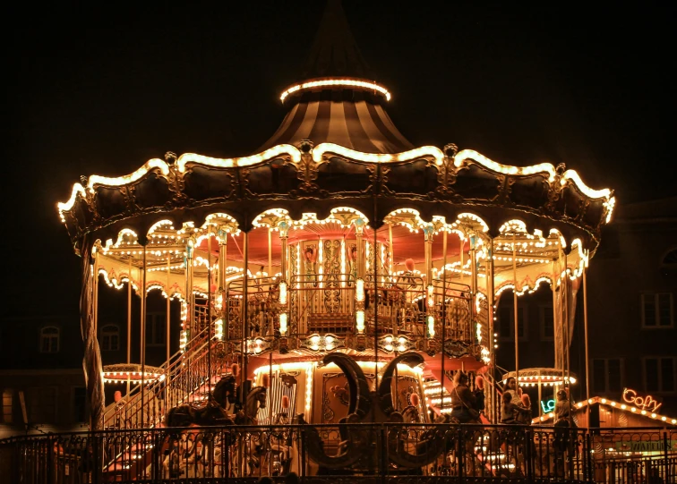 a very cute carnival ride lit up at night