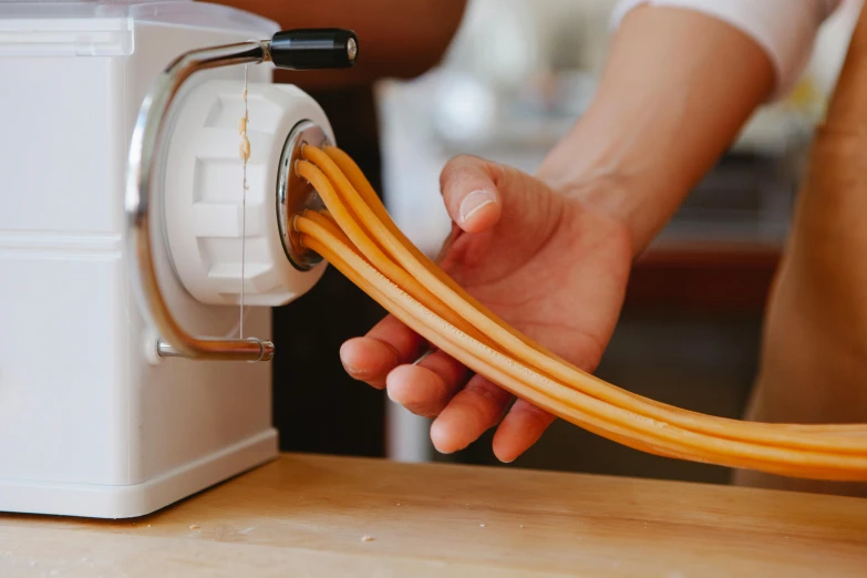 an electric cord that is being charged by someone