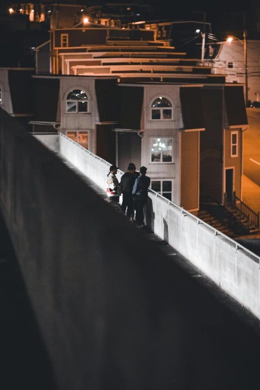 a group of people standing on top of a building