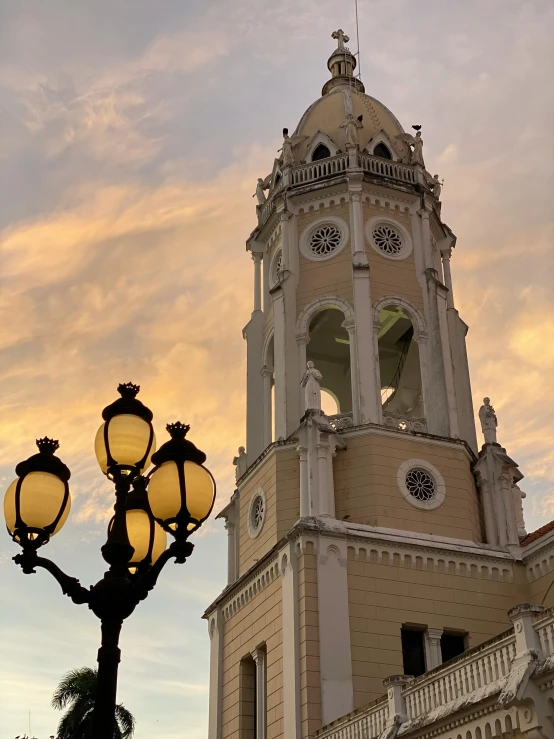 a tall clock tower sitting under a sky filled with clouds