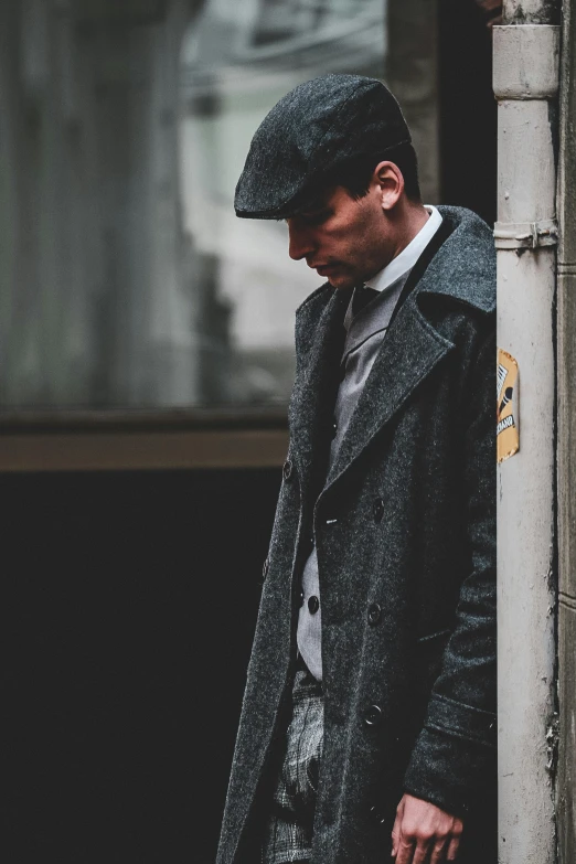 a man standing on the corner of a street