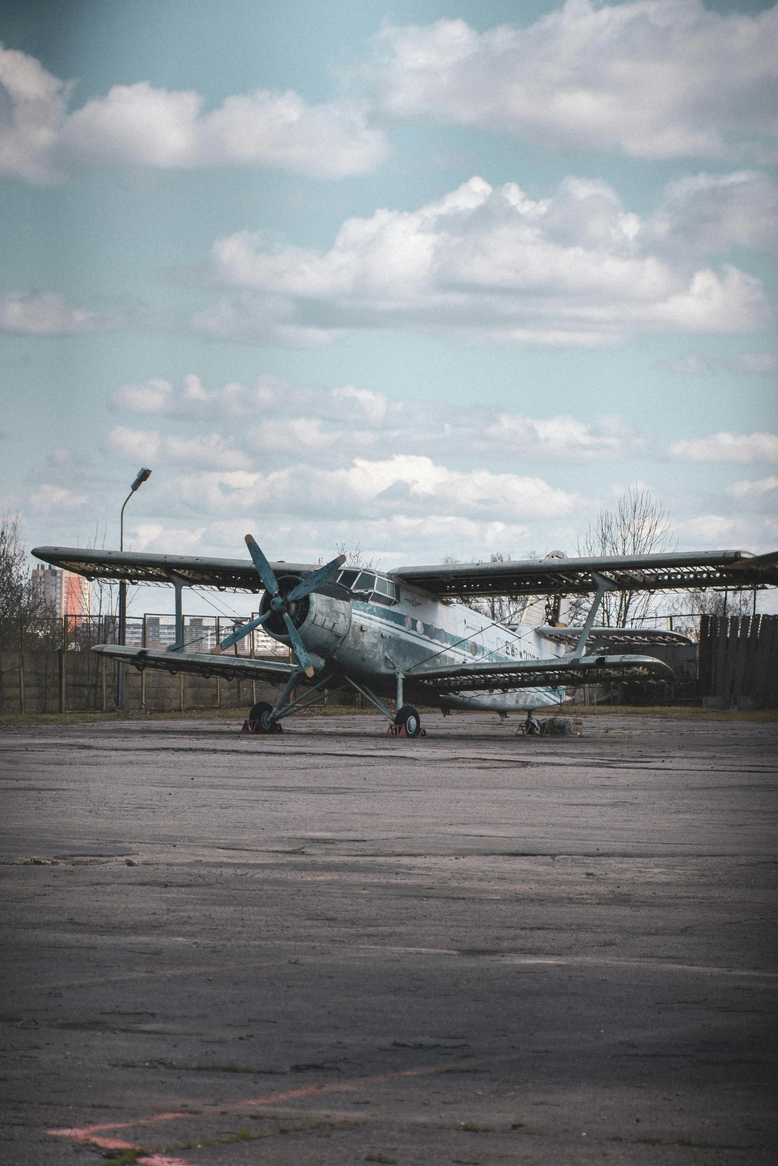 a small propeller airplane sitting on a runway