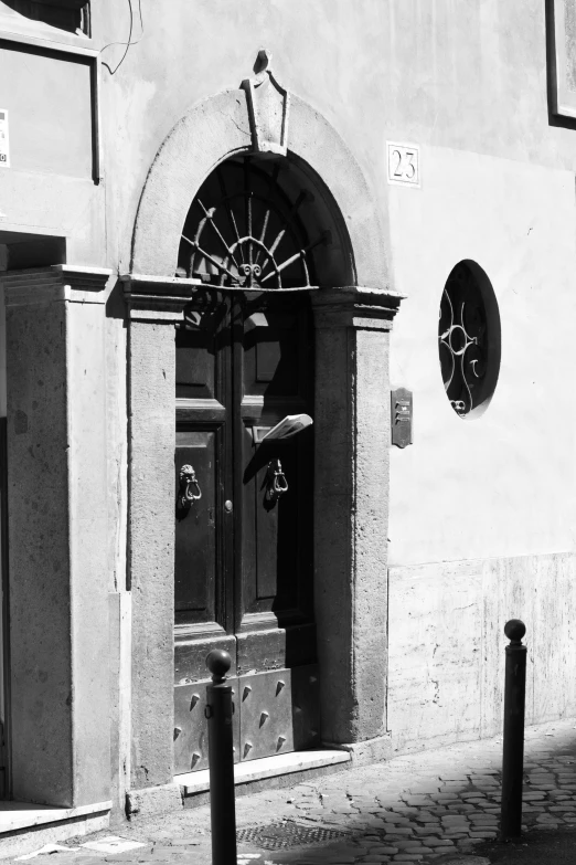 a black and white pograph of an entrance to a building