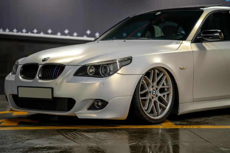 a bmw car parked in front of a building