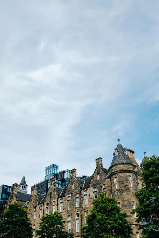 a large building with some towers in front