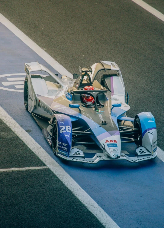 this car is racing down the track on top of it