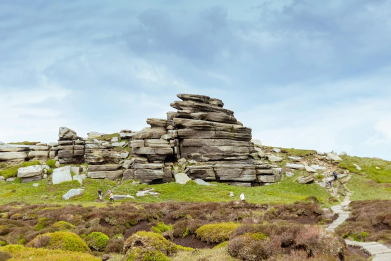 several rocks sitting atop a rocky hill