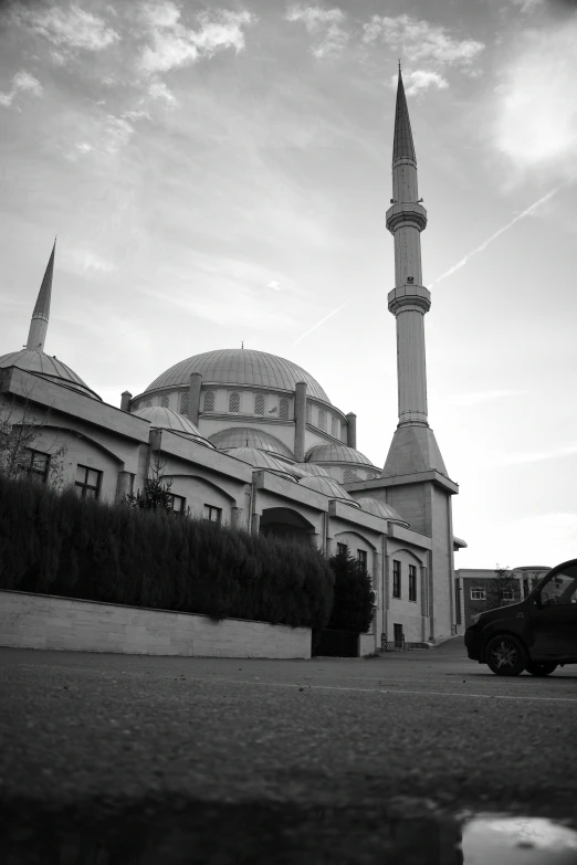 an architectural structure with large spire on the side of it