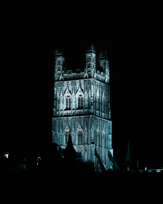 a tower with some windows sitting in the dark