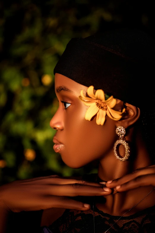 a woman wearing a hat and flower in her hair