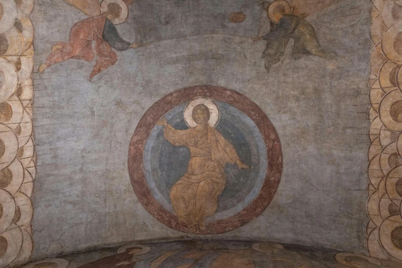 a fresco with the image of a woman holding a cross in a church
