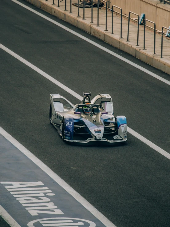 a racer racing on the track in a race car