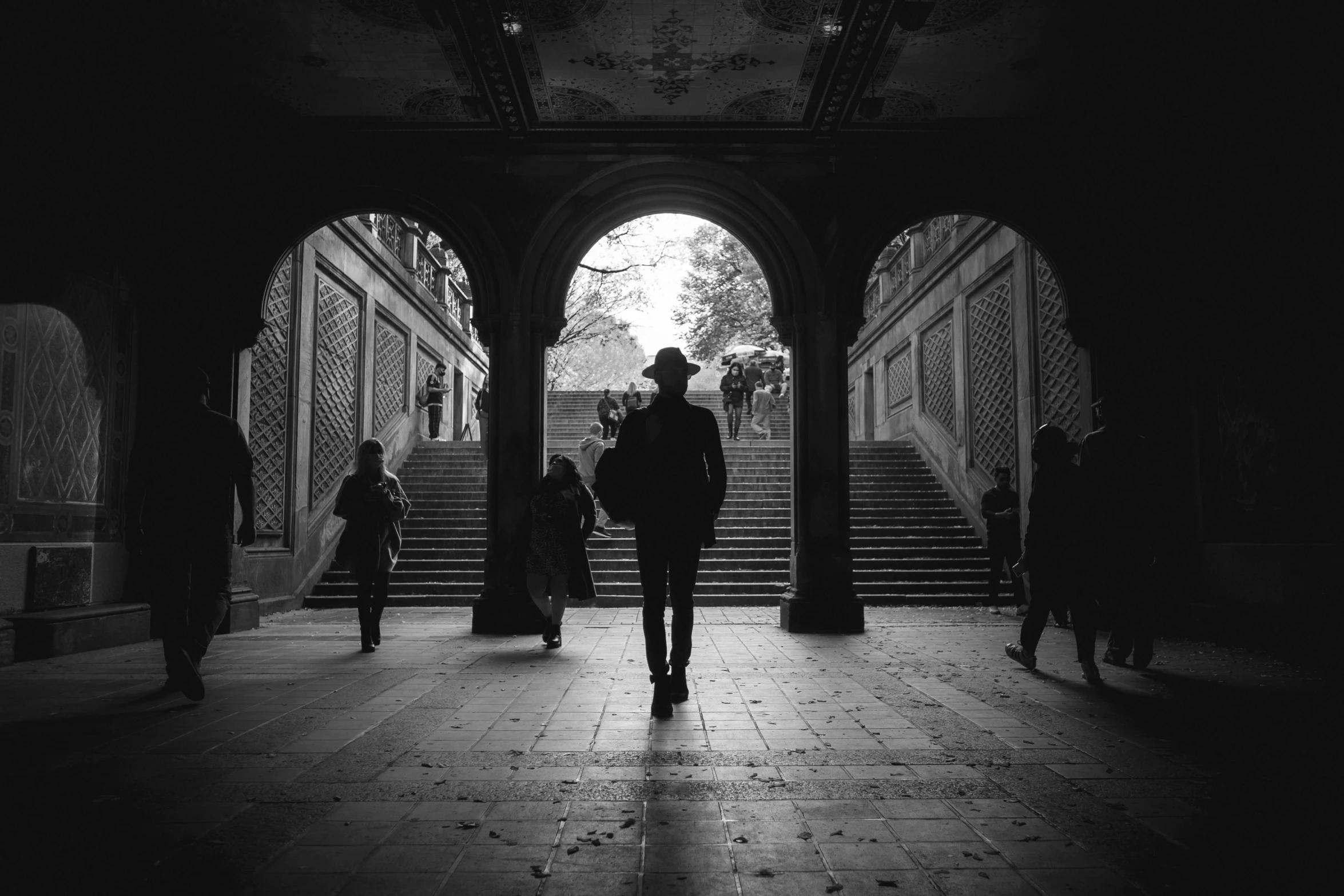 a black and white po of people in an archway