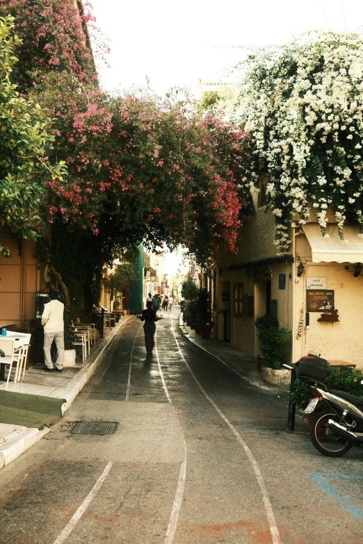 a person is walking down the street while someone waits for some food