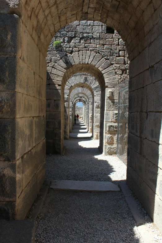 a small alley between two old stone buildings