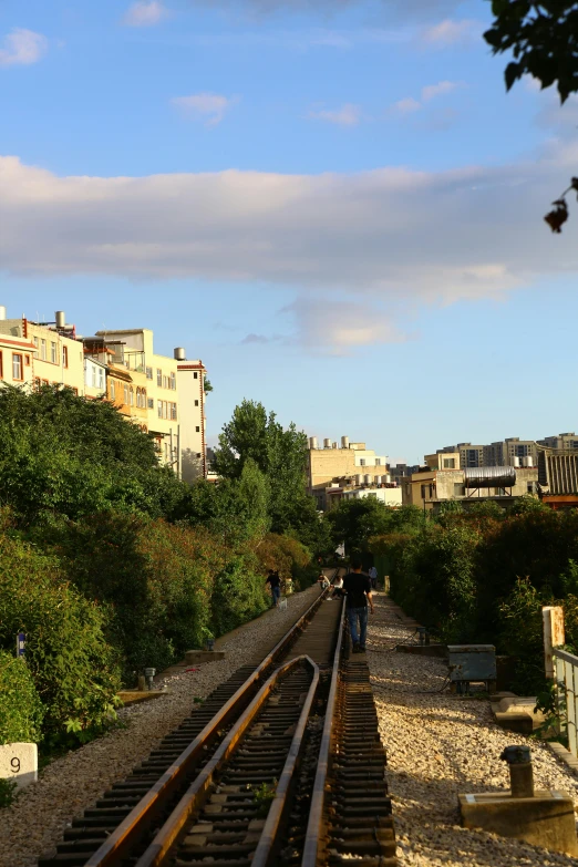 a train track with the sky in the background