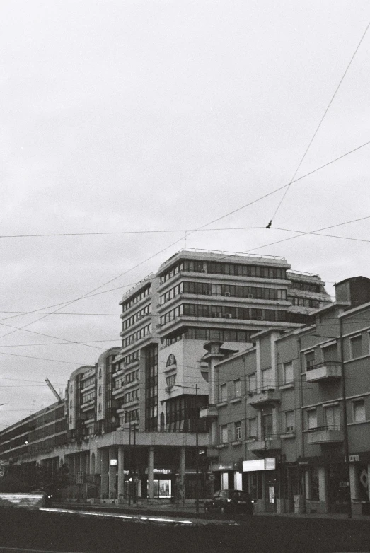 a black and white po shows many buildings on the street