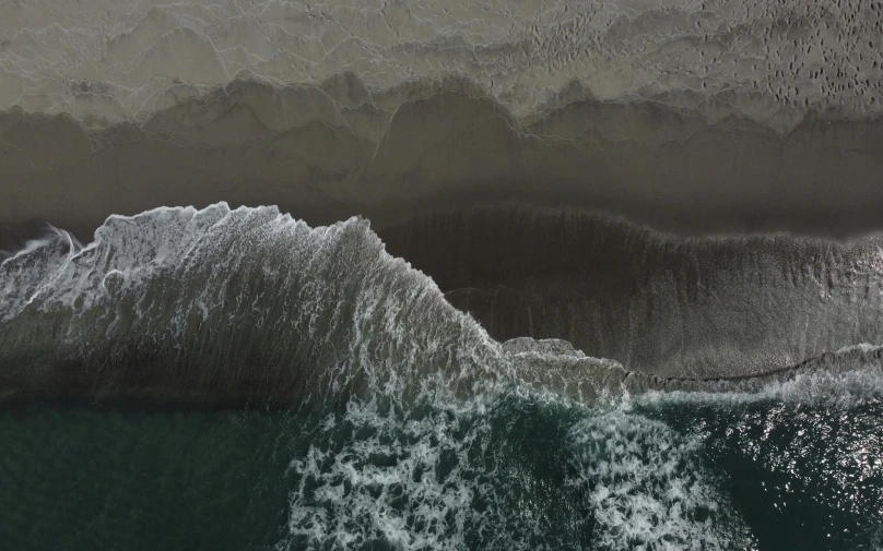 a water wave is next to an ocean beach