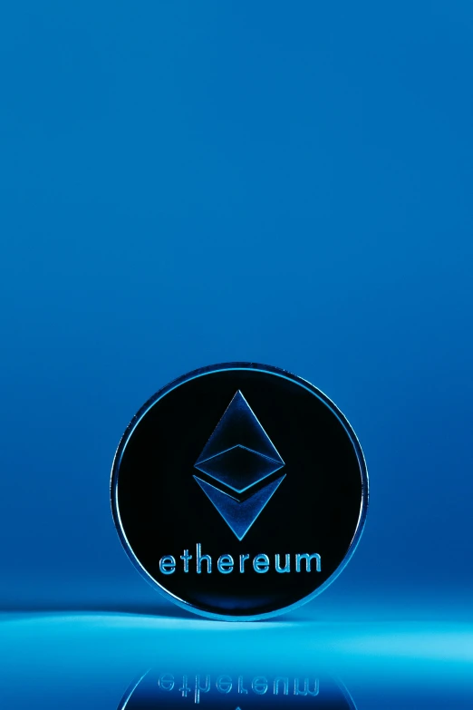 a small round black on with the words ethereum