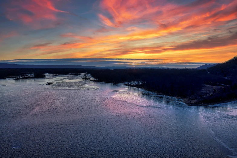 a sunset on the water is beautiful and colorful