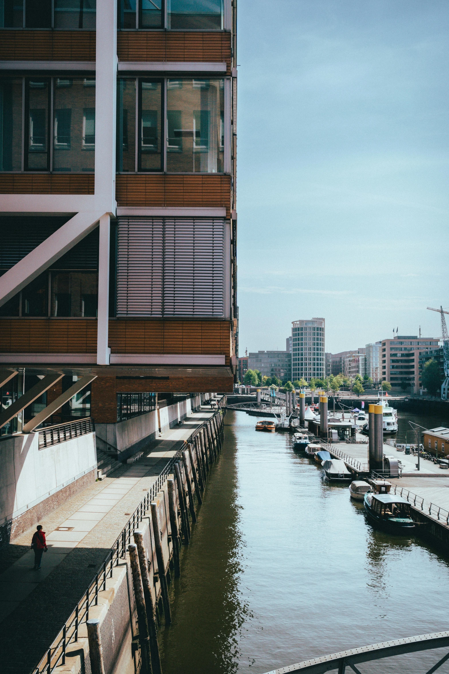 view of a marina near building with a boat in the bay