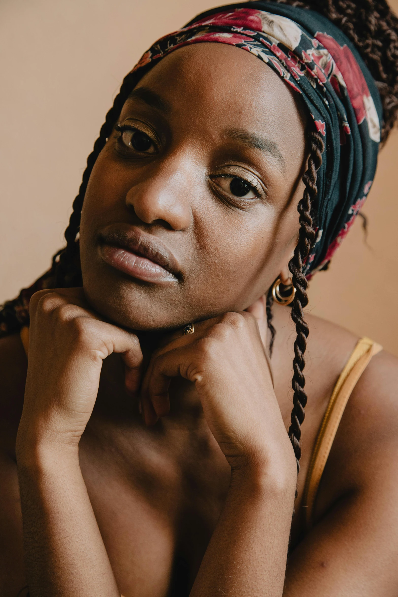 a black woman with ids and a bandana