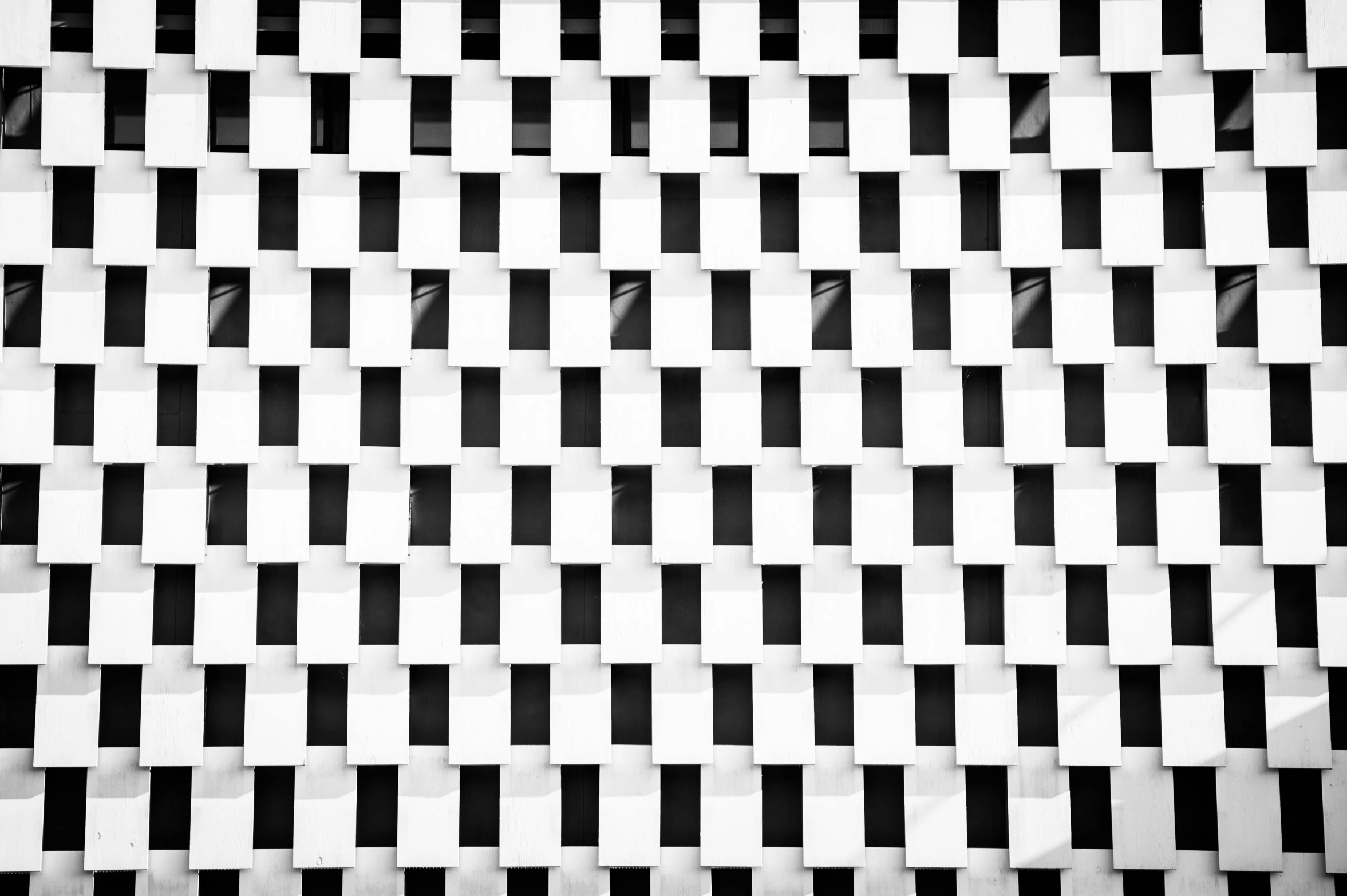 there is a black and white checkered pattern that appears to be a diagonal, grid - like piece of architecture