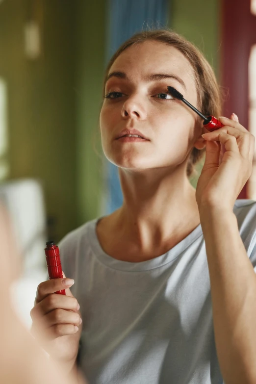 the  is doing her make up