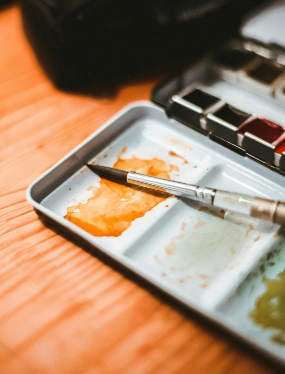 a painting that is sitting on top of a wooden table