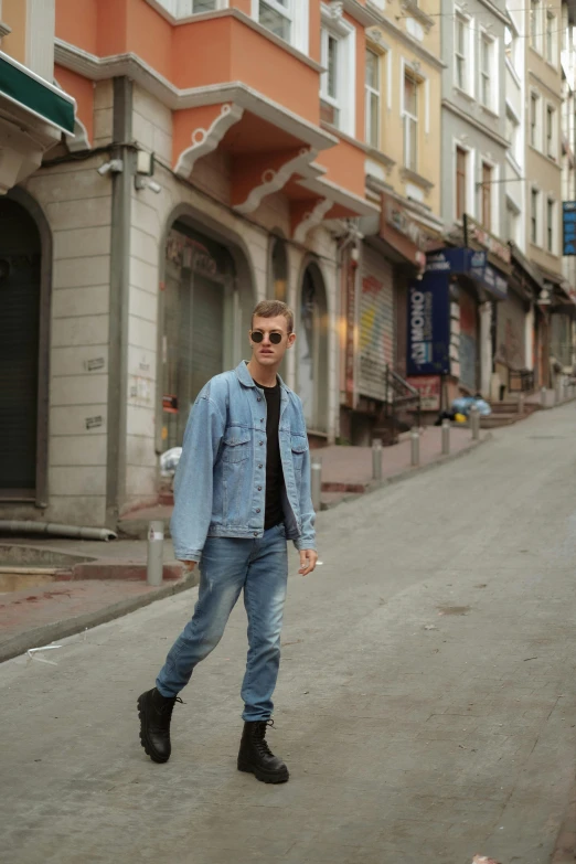 a man is standing in the middle of the road