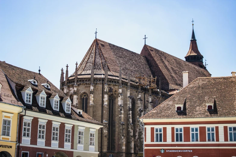 old building with large towers and a clock tower