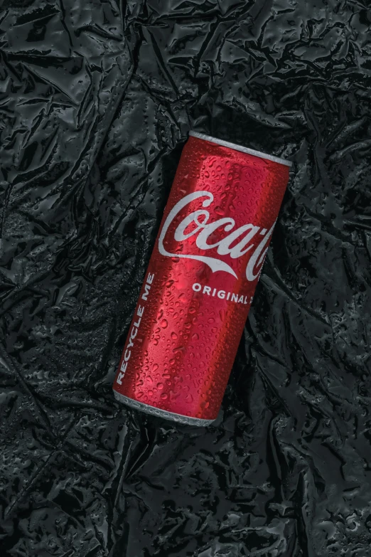 a soda can on an artistic background