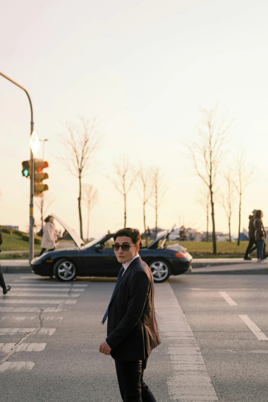 a man is crossing the street at an intersection