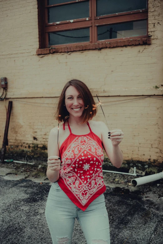 a woman in tights holds a long handled fork