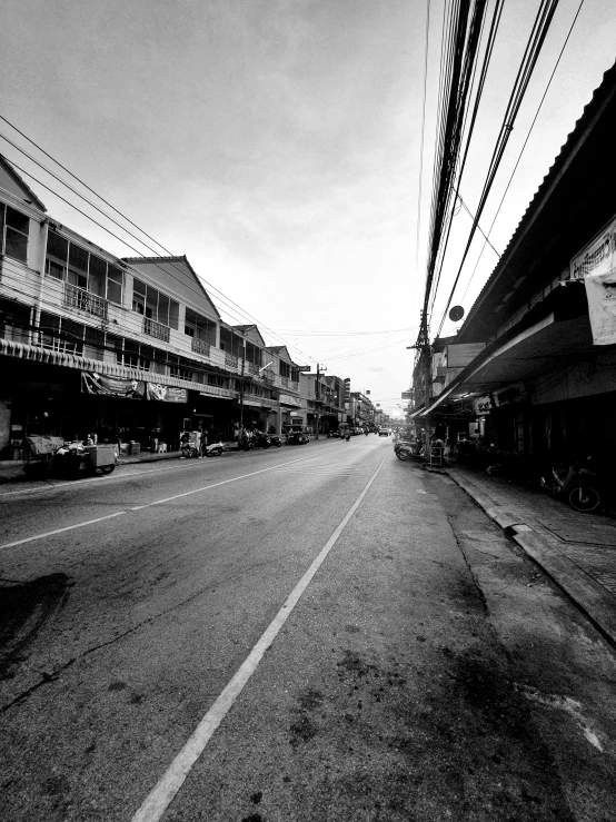 a dark and empty street lined with buildings