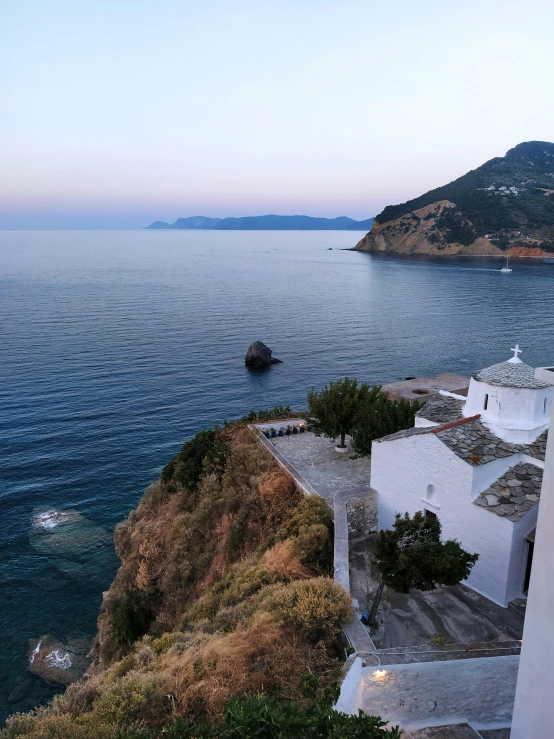 a couple of white houses sitting on top of a hill