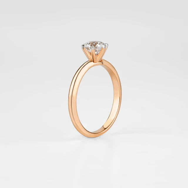 the top view of an elegant, four prong solde set engagement ring