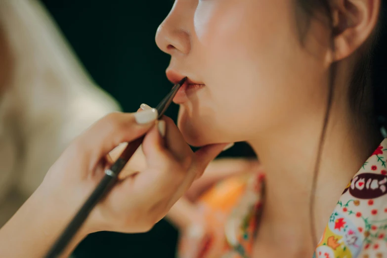 woman with nose rings, nails on, and long nose