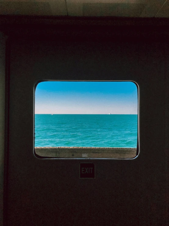 a view from a window looking at an ocean