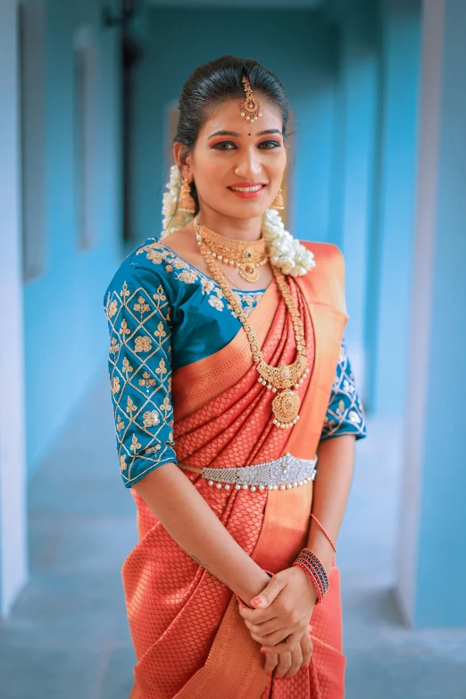 indian woman in traditional saree posing for camera