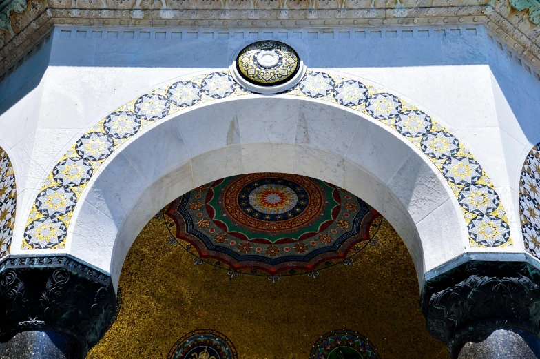 an ornate arch and gold and blue mosaic design