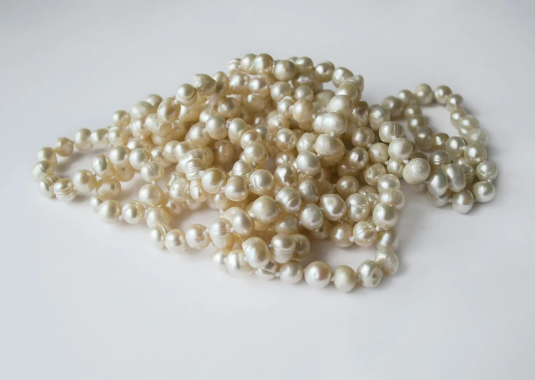 there are hundreds of pearls scattered on the table