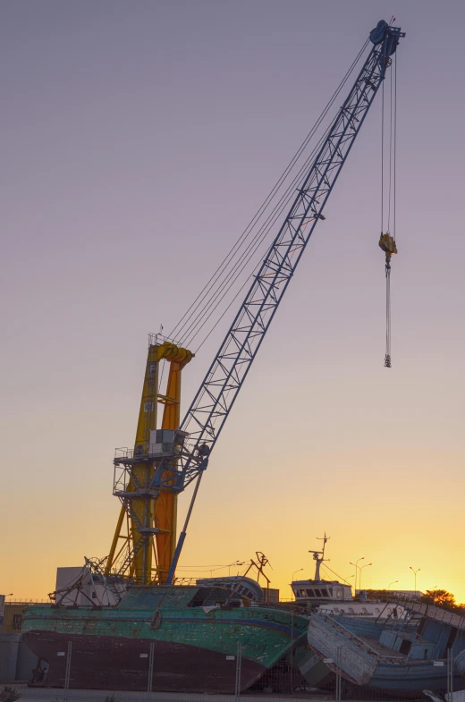 a crane is lifting up construction materials into place