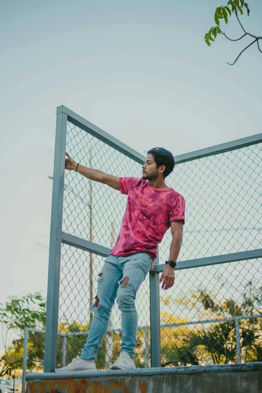 a man posing for a picture on top of some stairs