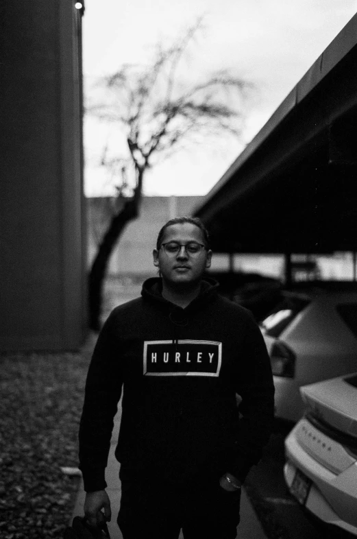 black and white pograph of a young man on street