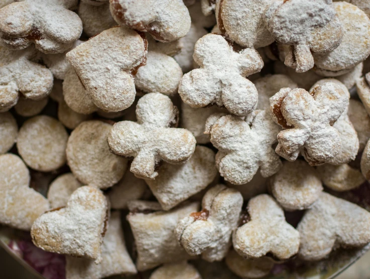 a plate filled with mini heart shaped cookies