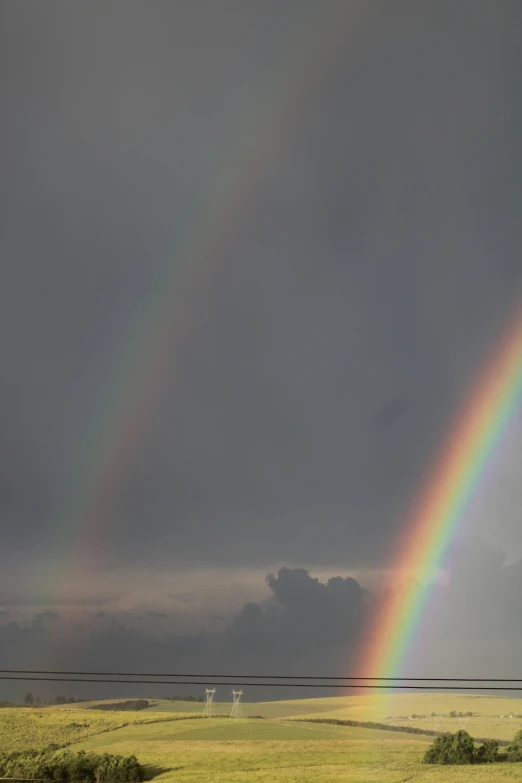 rainbows with some dark clouds in the background