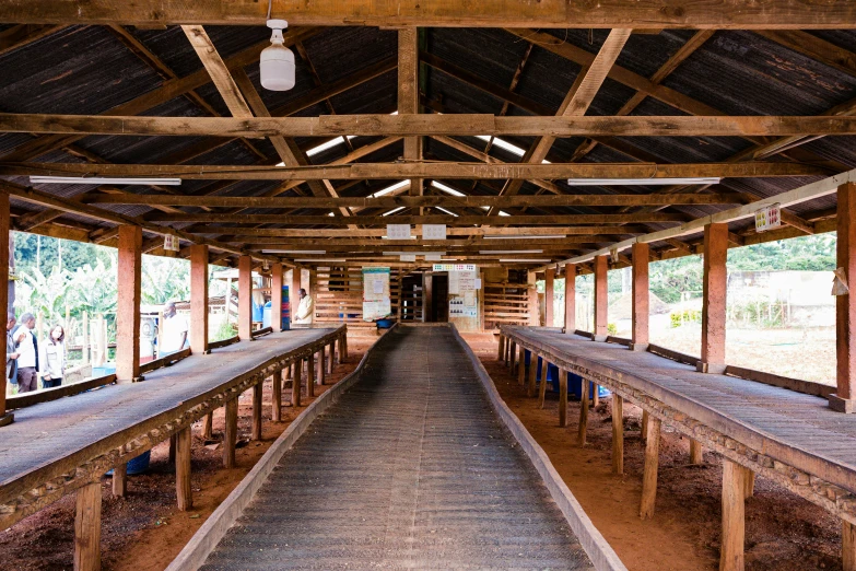 a very long wooden bench in a big room