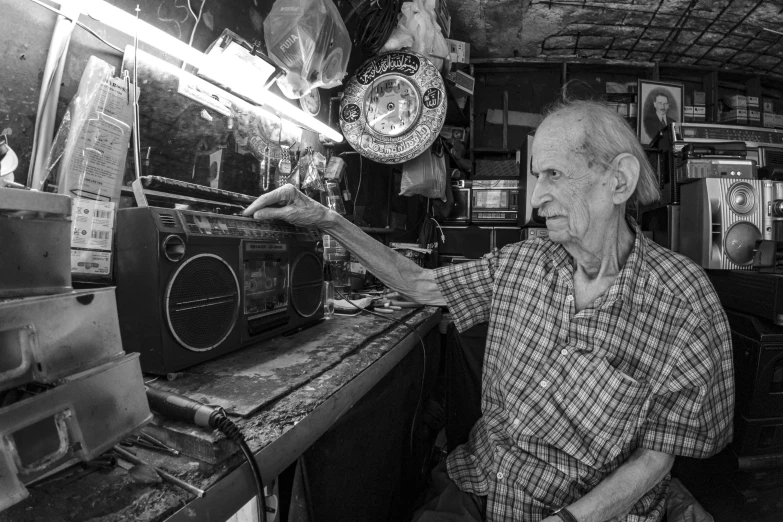 black and white image of a man in a shop