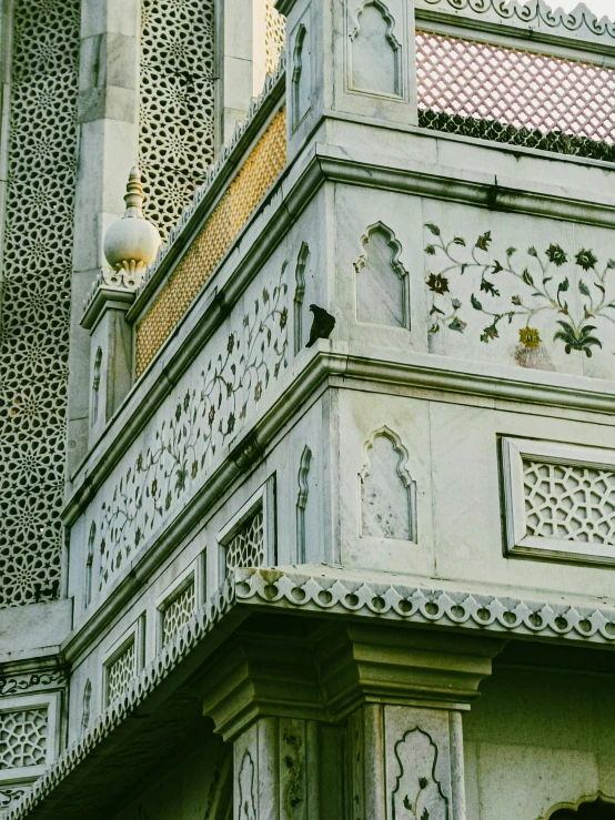 ornate white building with carved and tiled front